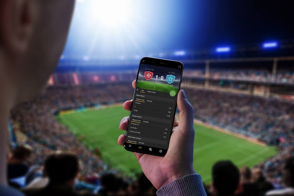 Sportwetten Apps - Die 10 besten Wett-Apps 1 Man,At,A,Football,Match,Follows,The,Odds,And,The